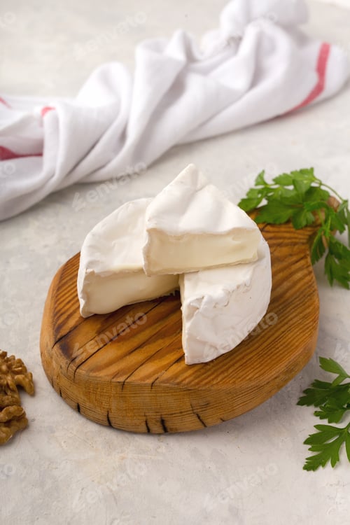 Preview: Brie Cheese on Wooden Board with Parsley