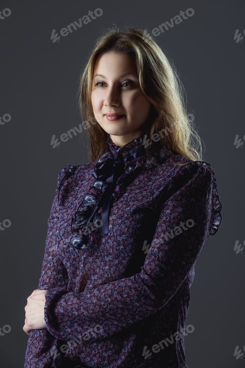 Preview: Low key portrait of size plus model in blouse and jeans