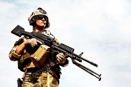 Preview: Serious Soldier with Automatic Weapon in Camouflage Uniform