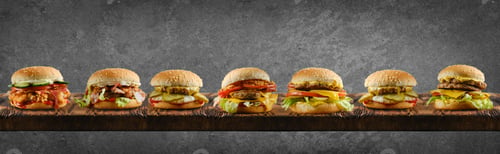 Preview: Assortment of different types of burgers on wooden board