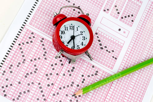 Preview: Exams quiz test paper with pencil drawing selected choice on answer sheets at school