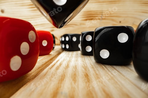 Preview: Red and black dice cubes on wooden background