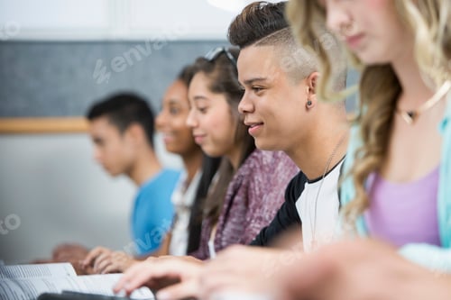 Preview: Row of teenage high school students in computer class