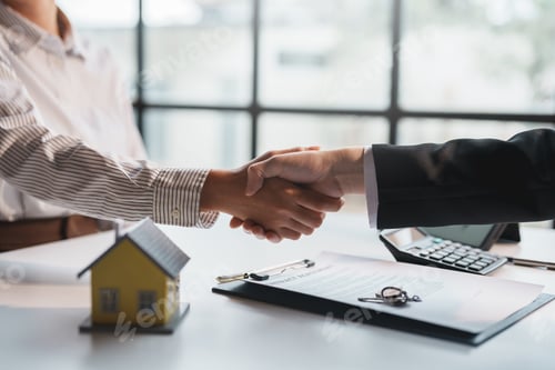Preview: Real estate agent has entered into a contract to sell the house to the customer handshake congratula