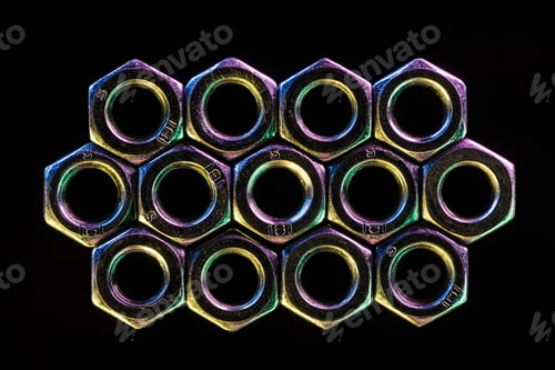 Preview: close up view of shiny metal nuts isolated on black