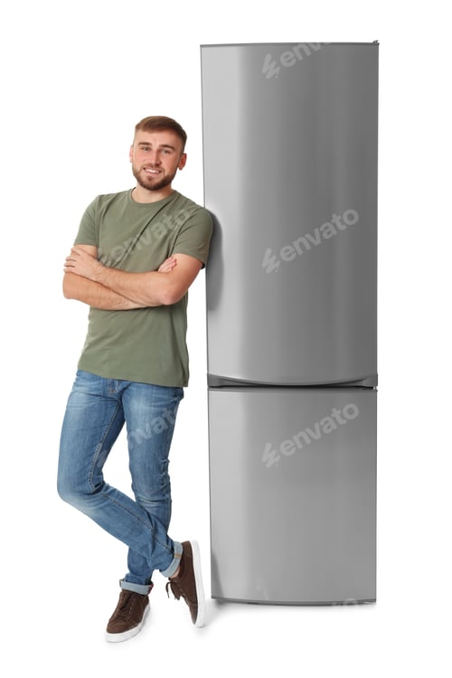 Preview: Young man near closed refrigerator on white background