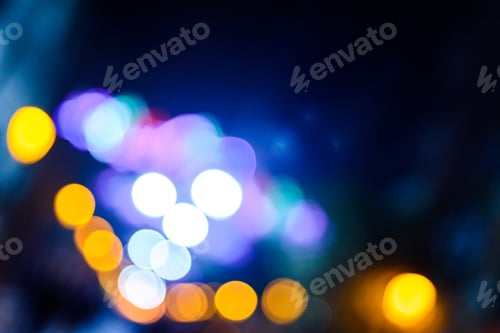 Preview: Defocused urban night background with colorful circles.