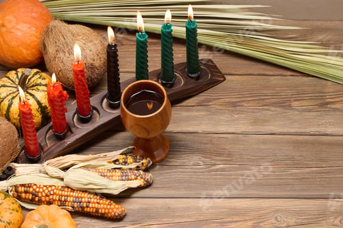 Preview: Kwanzaa Celebration Setup. A festive Kwanzaa display with candles, fruits, and decorative elements