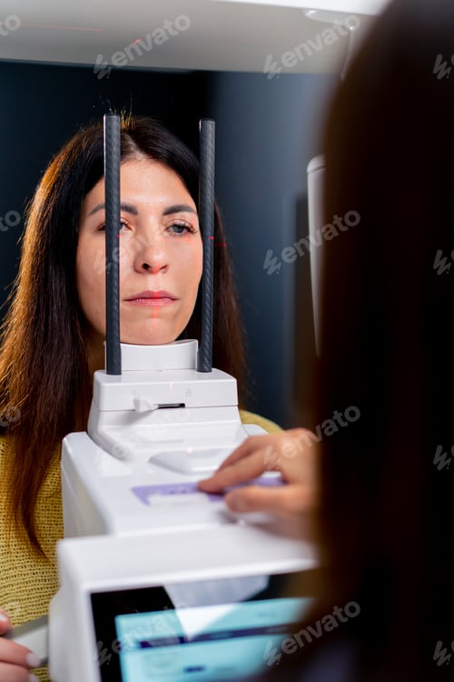 Preview: portrait of a beautiful woman doing a 3D scan of the nose and oral cavity in plastic surgery clinic