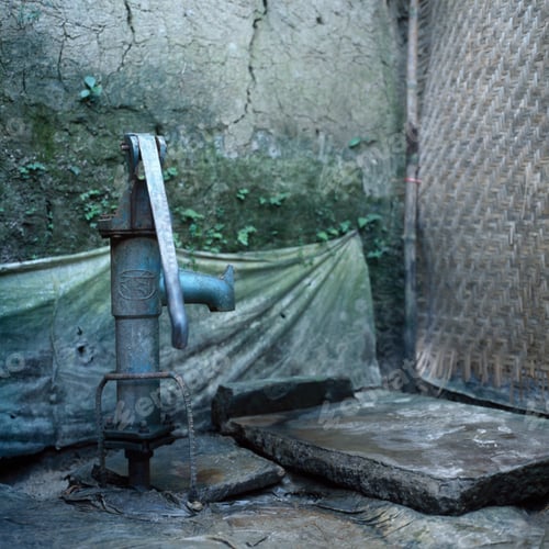 Preview: Old water pump on city street