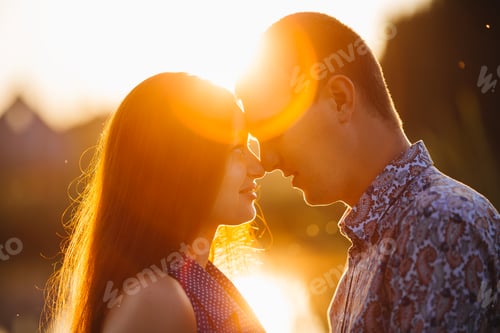 Preview: Portrait of brunette woman and man kissing and embracing face to face