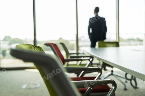 Preview: Conference room with businessman at the window