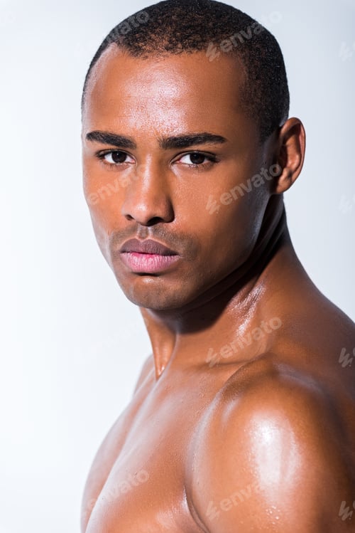 Preview: portrait of handsome shirtless african american sportsman looking at camera isolated on grey