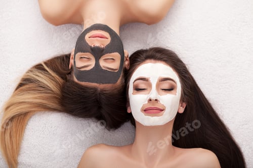 Preview: Spa. Woman with facial mask and cucumber slices in her hands