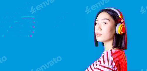 Preview: portrait young asiatic woman isolated listening music