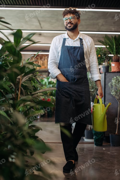 Preview: Florist walking through plant shop holding watering can