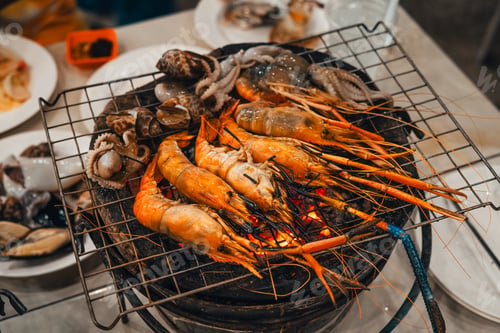 Preview: Shrimp grilled in a charcoal grill at a street food