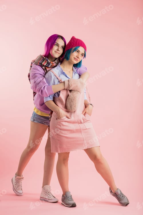 Preview: Two best smiling friends in stylish clothes and creative hairstyle