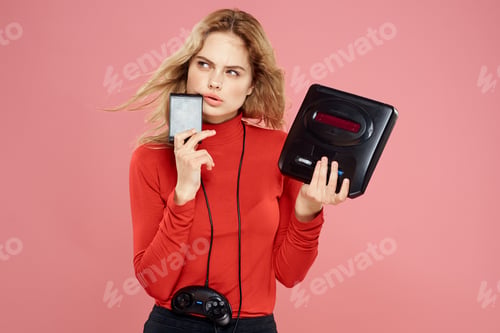 Preview: Woman with video game attachment lifestyle entertainment lifestyle pink background