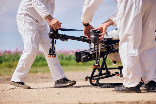 Preview: Two male workers assemble the agrodrone, preparing him to fly over the poppy seeds field.