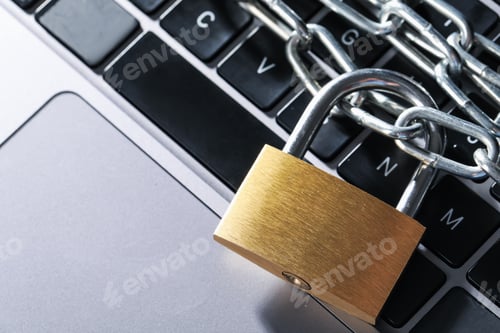 Preview: Cyber safety. Metal padlock with chain on laptop, top view