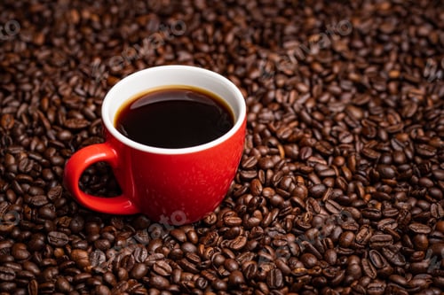 Preview: Red Cup of black coffee on table covered with coffee beans