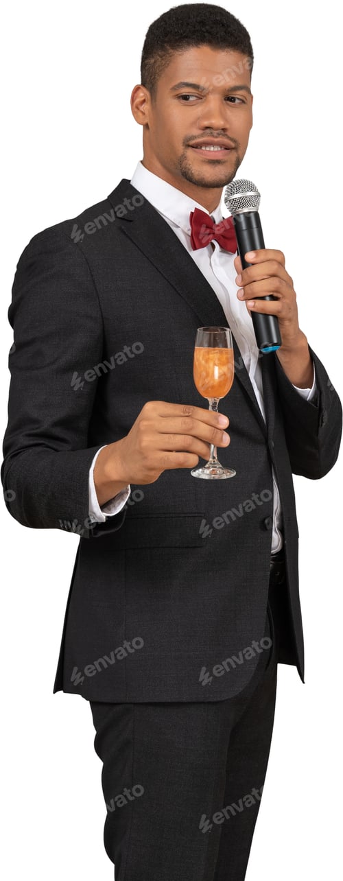 Preview: a man in a suit and bow tie holding a glass of wine
