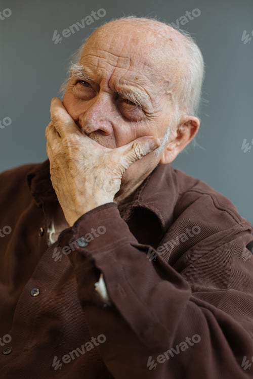 Preview: Close up. Thoughtful portrait of a gray-haired old man.