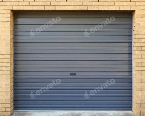 Preview: Grey garage door corrugated metal on blonde brick wall frame,background,negative space for text