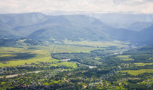 Preview: View from the top of the mountain to the valley with the river