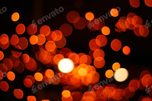 Preview: Orange bokeh lights on a black background- a cool wallpaper
