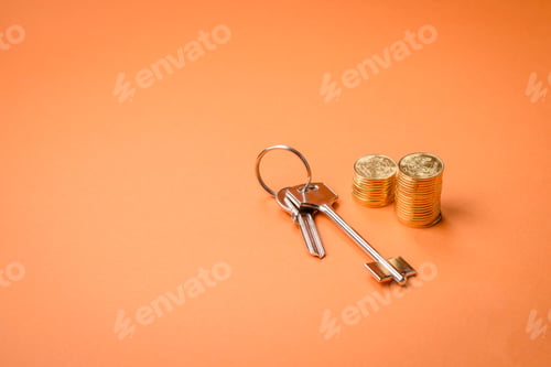 Preview: A small wooden house, money and keys as an idea for investing in your own home