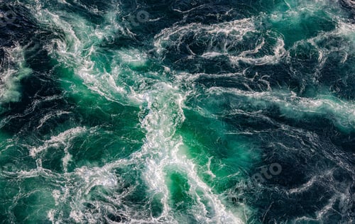 Preview: Blue waves of water of the river and the sea meet each other during high tide and low tide.