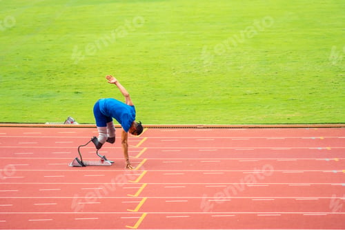 Preview: Asian para-athletes disabled with prosthetic blades running at stadium.