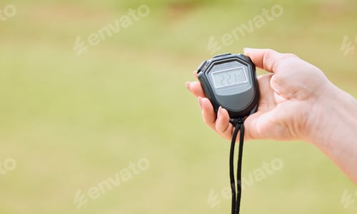 Preview: Hand Holds Stopwatch with Green Background