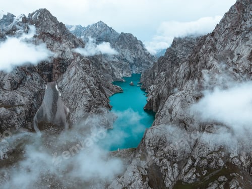 Preview: Aerial view of Kol Suu Lake shrouded in mountain mist