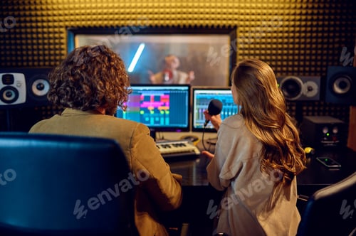 Preview: Musicians at mixing console, recording studio