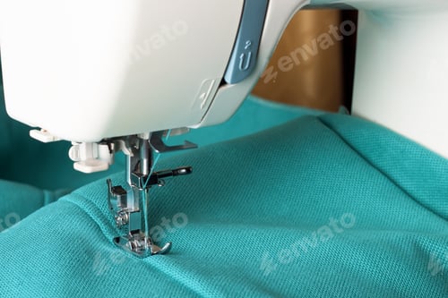 Preview: Modern sewing machine and turquoise fabric