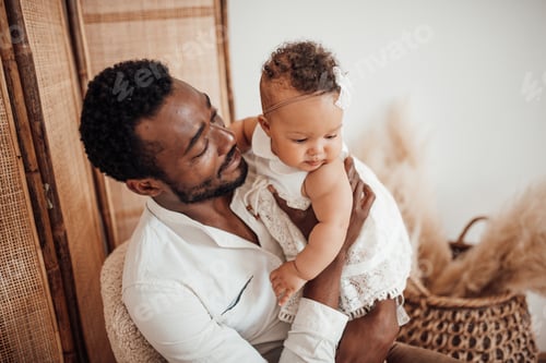 Preview: Happy candid black ethnicity dad spending time together with toddler ebony daughter in apartment