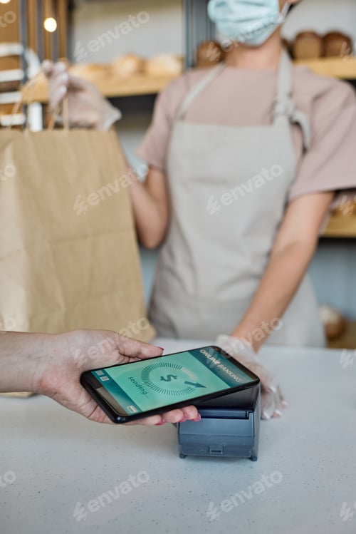Preview: Paying with smartphone in bakery