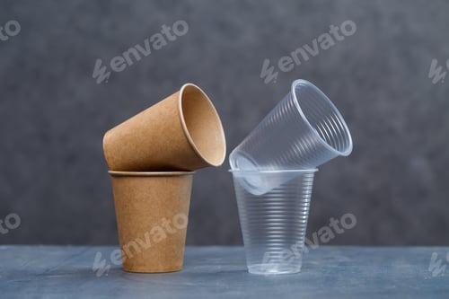 Preview: Eco-friendly disposable tableware made of bamboo wood and paper on a gray background. Plastic dishes