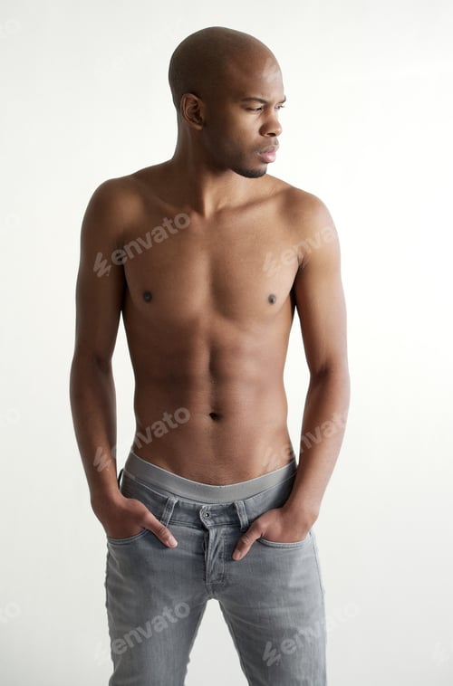Preview: Good looking young man standing on white background