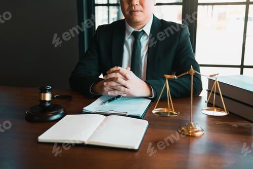 Preview: Justice and law concept with male lawyer in the office.