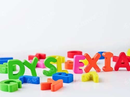 Preview: Dyslexia word bright colorful wooden toy blocks in white background. Dyslexia concept. difficulty wi