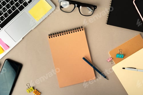 Preview: Open laptop with blank notebook, view from above. Workplace concept