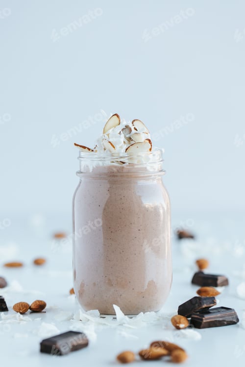 Preview: Vertical shot of a chocolate protein shake on the white background