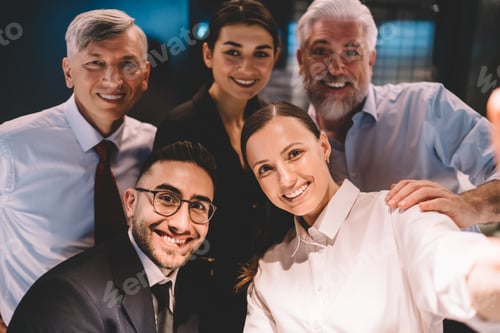 Preview: Group of colleagues taking pictures in office