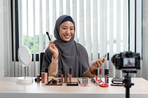 Preview: Woman muslim blogger is showing present make up tutorial beauty cosmetic review product and broad