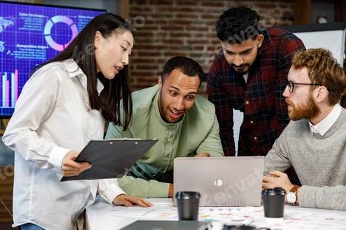Preview: A team of young multinational business people are working on a startup. New generation of startups