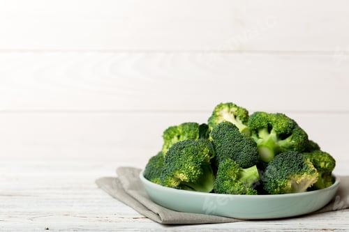Preview: broccoli of fresh green broccoli in bowl over coloredbackground. , close up. Fresh vegetable